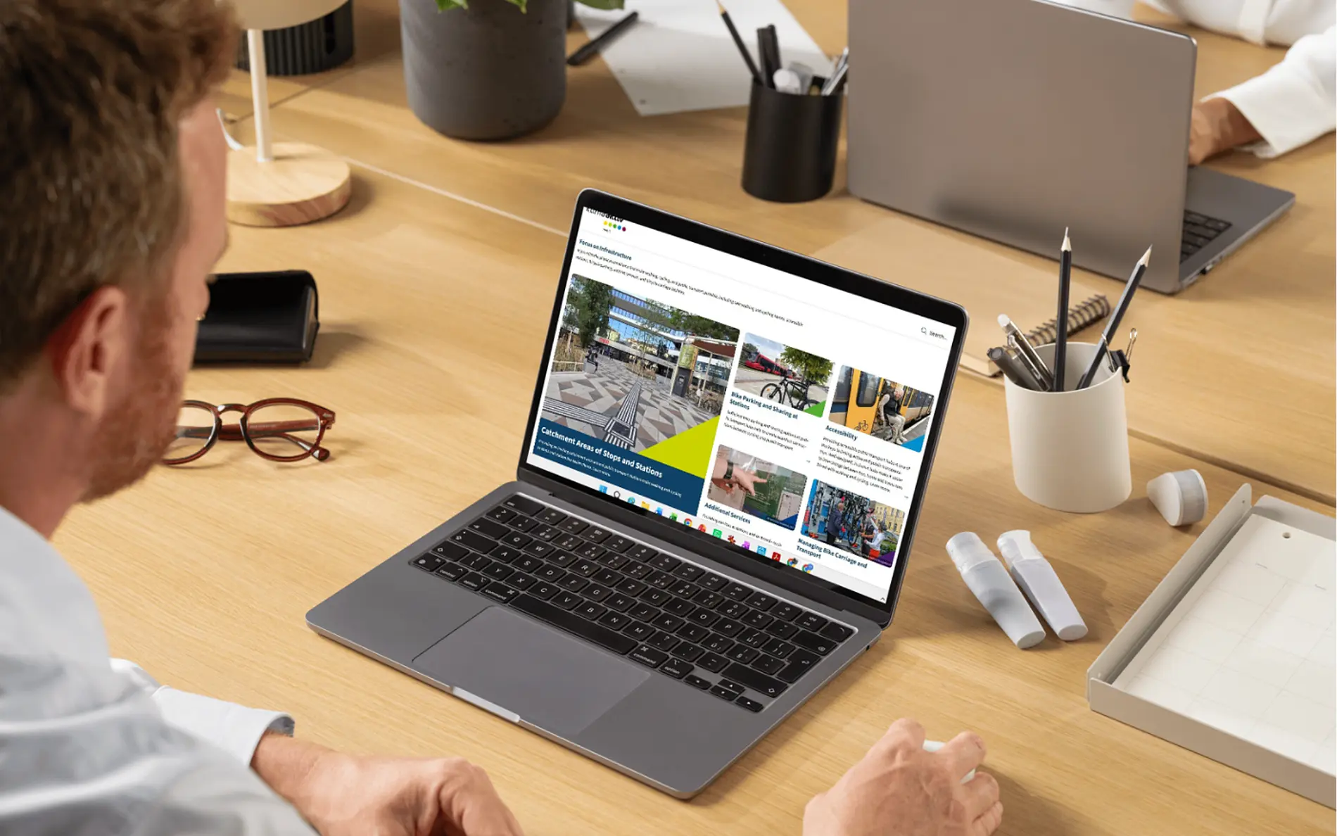 Laptop in an office shows the start page of the 'Active2Public Transport Toolbox"