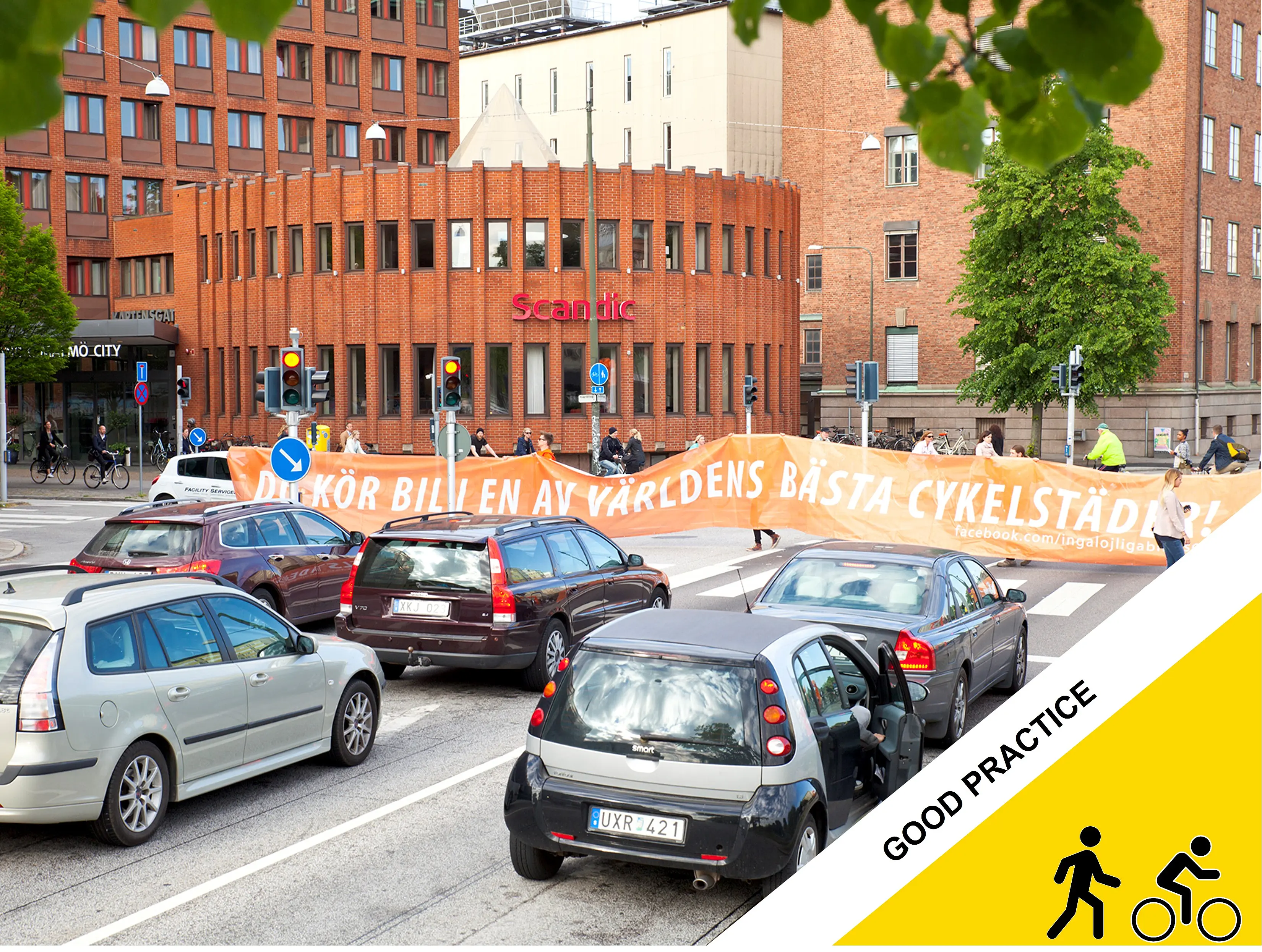 Banner “You are driving a car in one of the world’s best cycling cities.”    