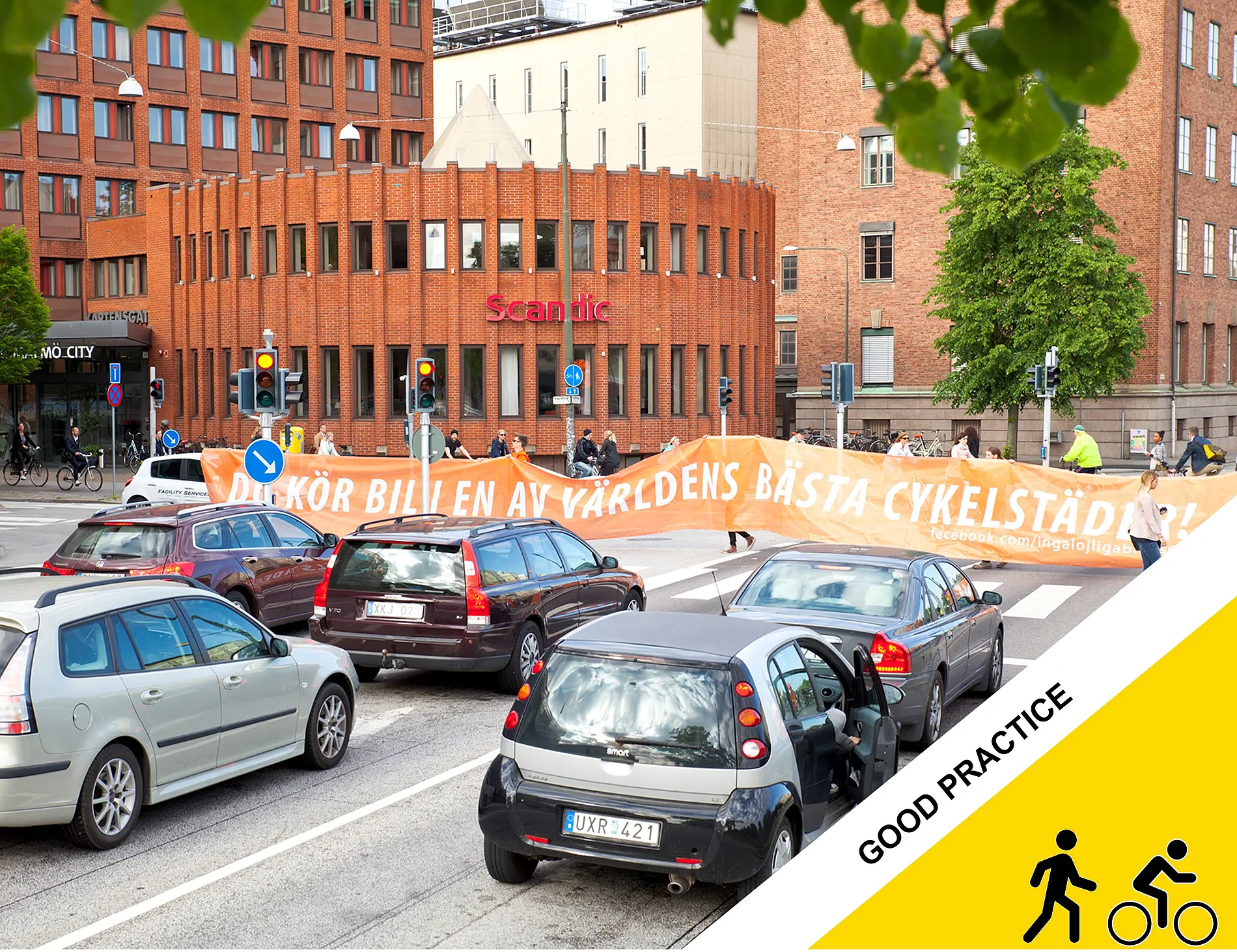Banner “You are driving a car in one of the world’s best cycling cities.”    